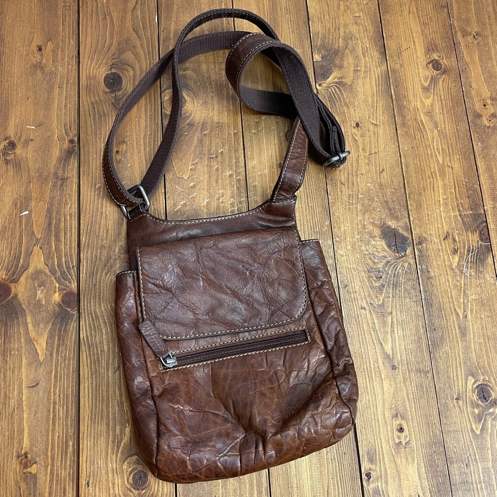 Jack George’s brown leather crossbody purse voyager slim crossbody bag